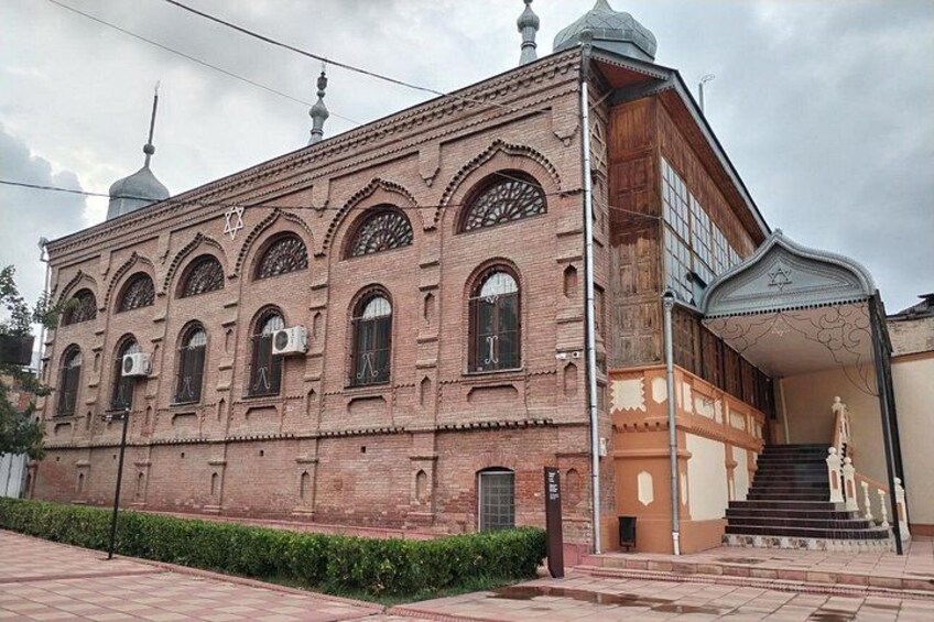 A historic building with arched windows and a dome. 5