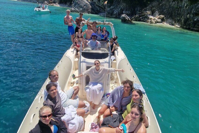 A group of people on a boat in clear turquoise water. 3