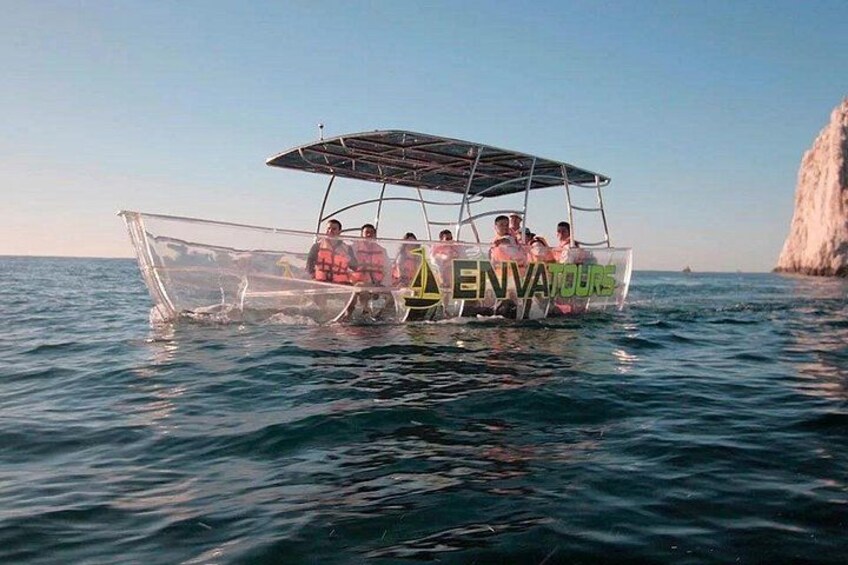 A boat with a canopy labeled 'ENVATOURS' on the water. 5