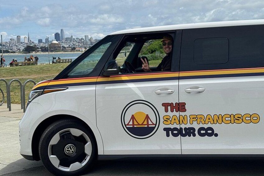 A white van with 'The San Francisco Tour Co.' logo and a bridge silhouette. 2