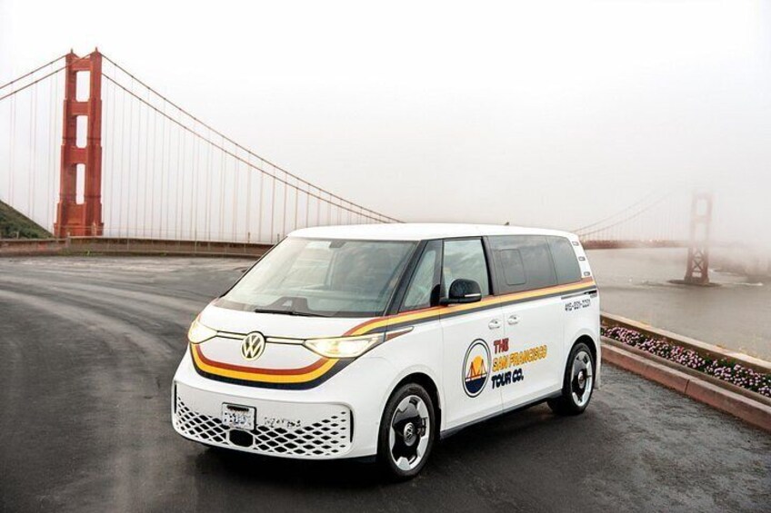 A white van with yellow and red stripes parked on a bridge. 3