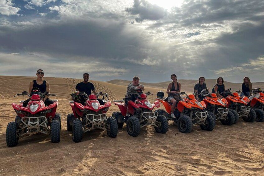 A group of people on ATVs in a desert landscape. 5