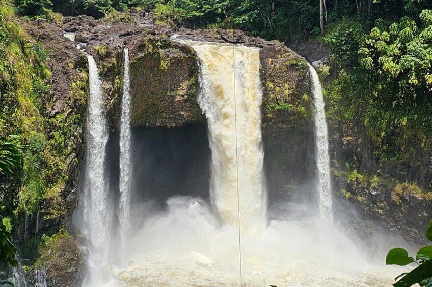 A multi-tiered waterfall surrounded by lush greenery. 4