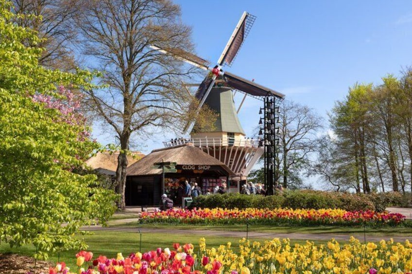 A windmill, a flower garden, and a building labeled 'CLOG SHOP.' 4