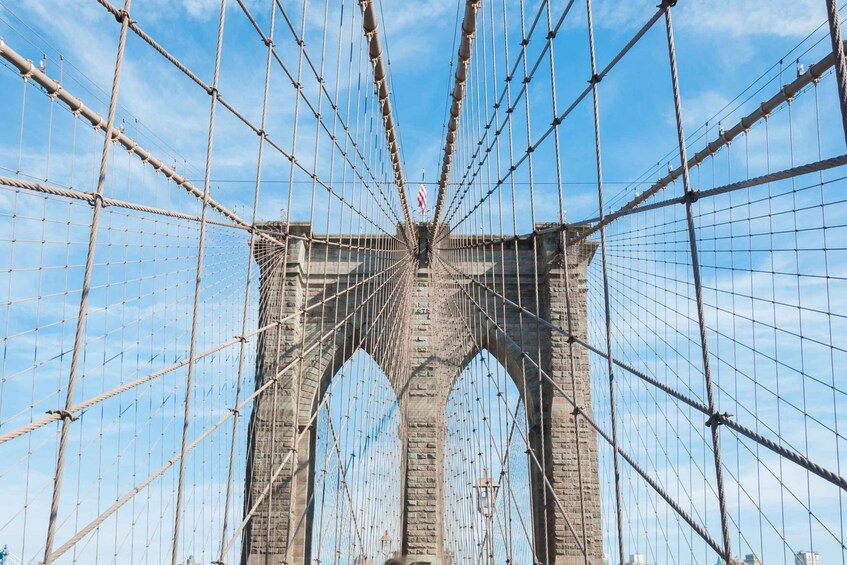 The Brooklyn Bridge's intricate steel cables and stone arches. 3