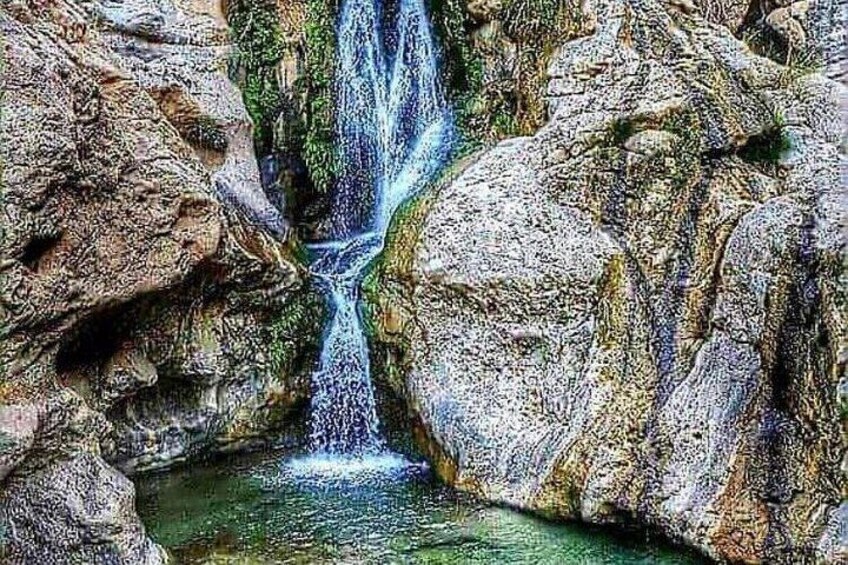 A waterfall cascading over rocks. 2