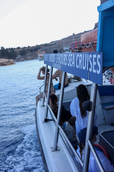 A boat with a sign advertising 1-3 hour sea cruises. 2
