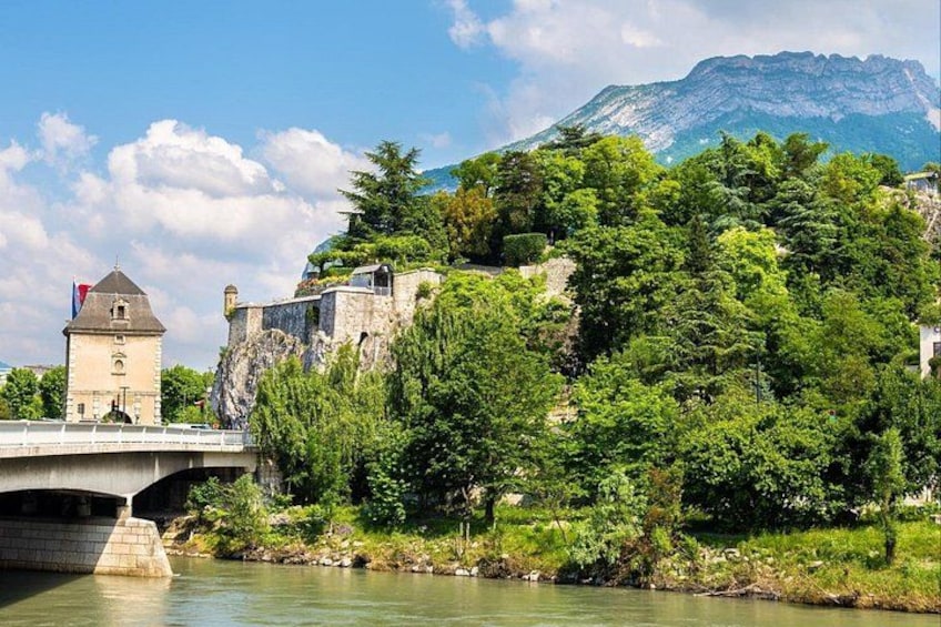 A bridge, a tower, and a mountain. 1