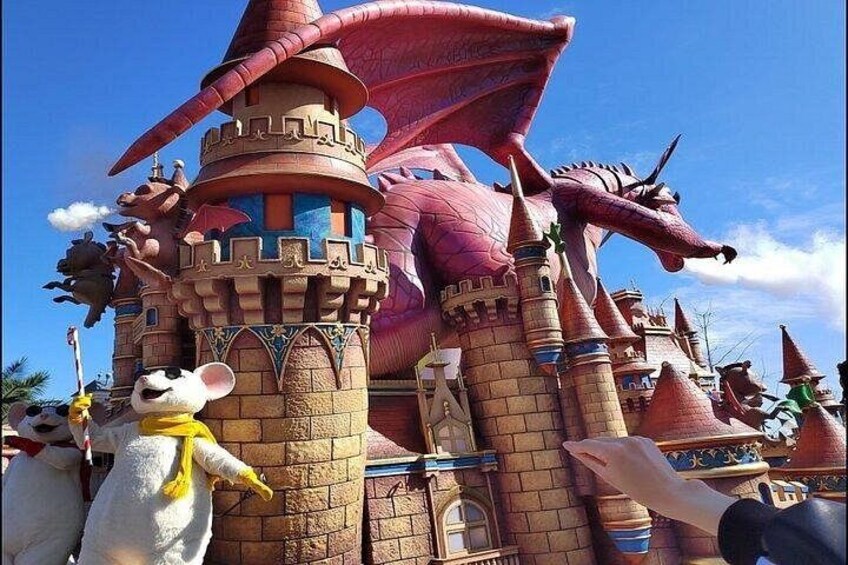 A castle-like structure with a large dragon and a character resembling a mouse. 1