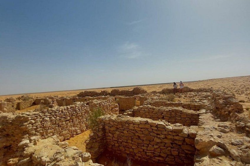 Ancient stone ruins in a desert landscape. 2