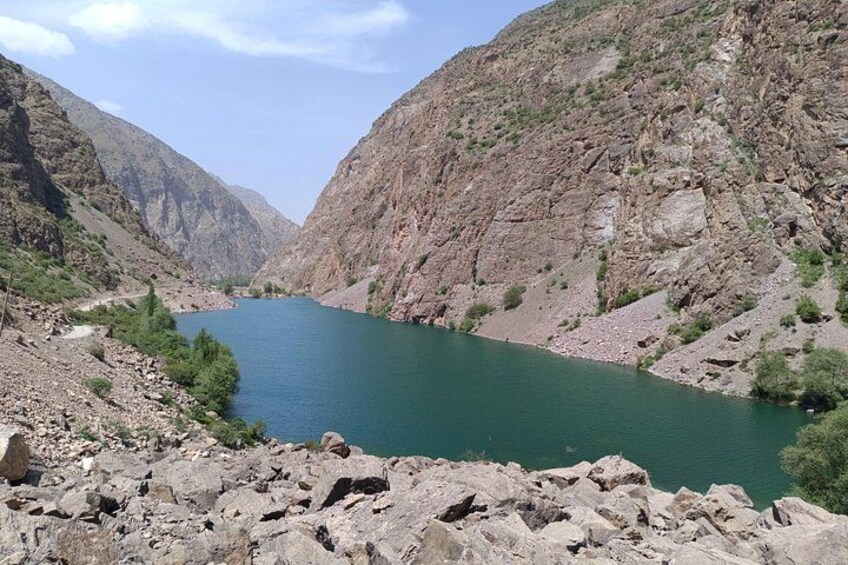 A river winding through a rocky canyon with steep cliffs on either side. 3