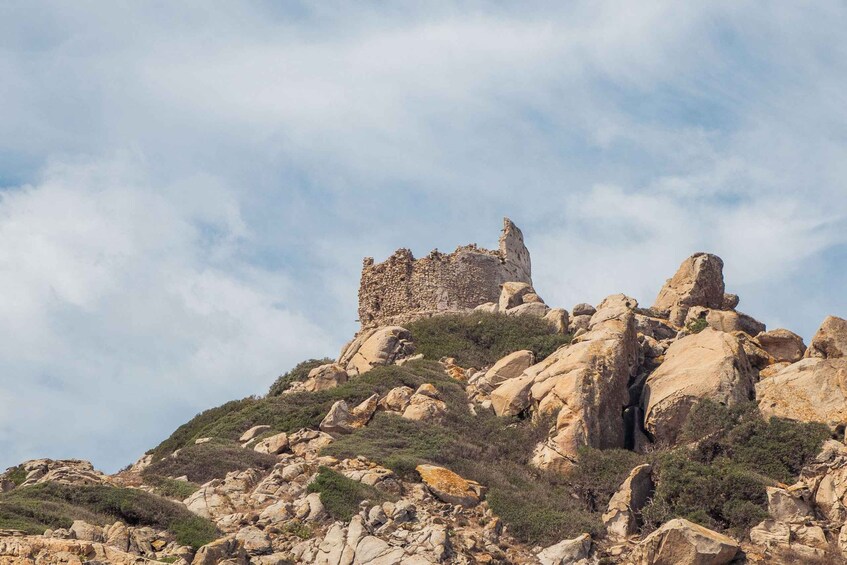 A rocky hill with a ruined castle on top. 5