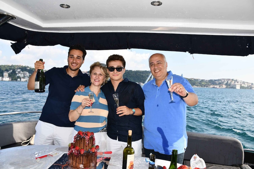 A group of people on a boat with a cityscape in the background. 4