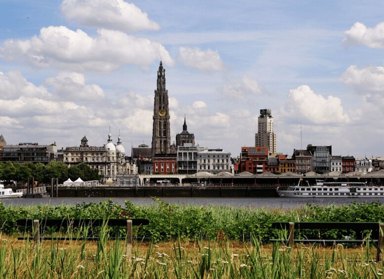 A city skyline with historic buildings and a river. 4