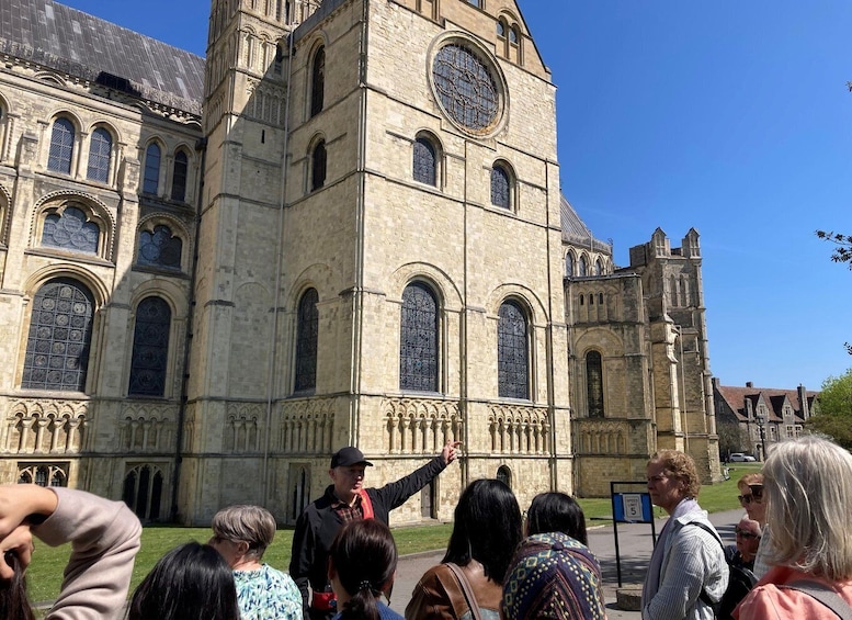 A historic building with arched windows and a clock tower. 2