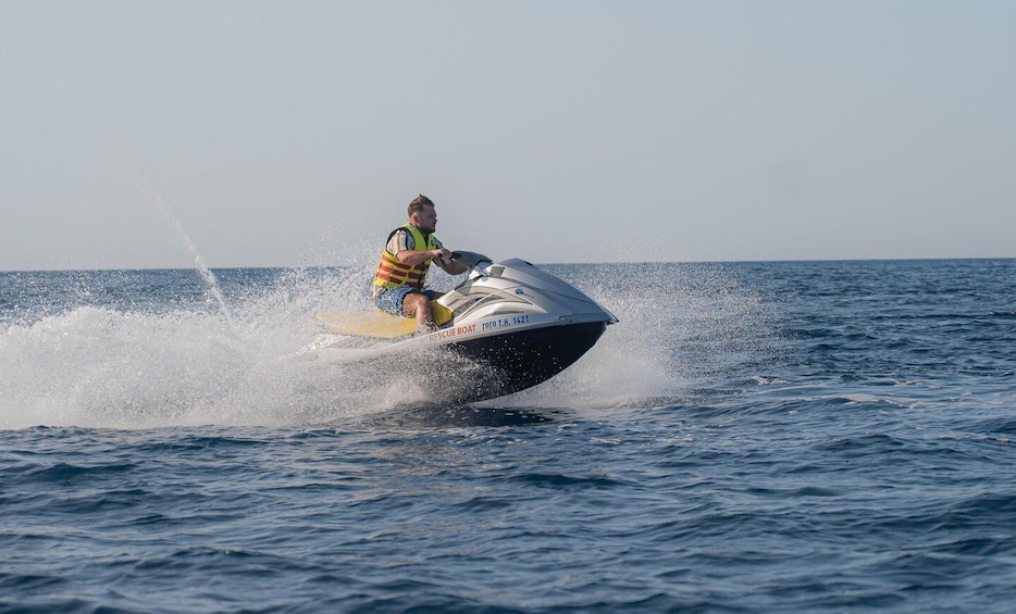 A person jet-skiing on a body of water. 3