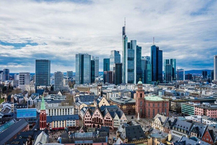 A cityscape with modern skyscrapers and historic buildings. 3