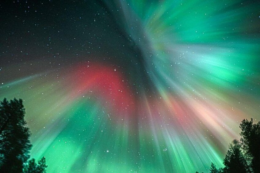 The aurora borealis with green, red, and blue lights. 2