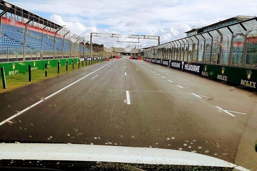 A race track with barriers and advertisements. 3