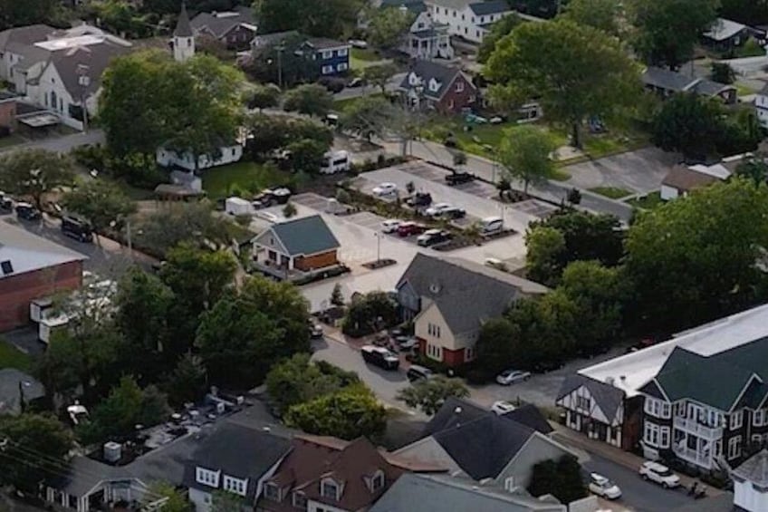 A residential area with houses, a church, and a parking lot. 3