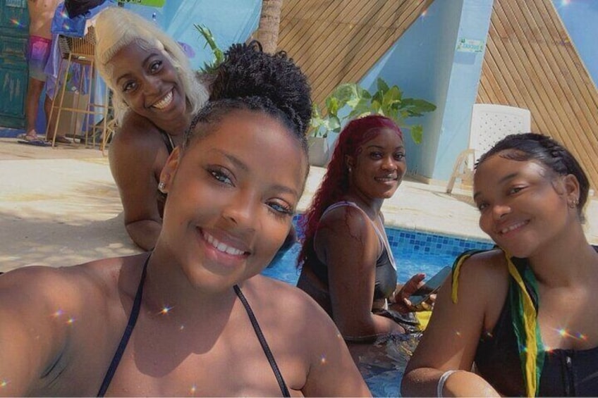 A swimming pool with people around it. 5