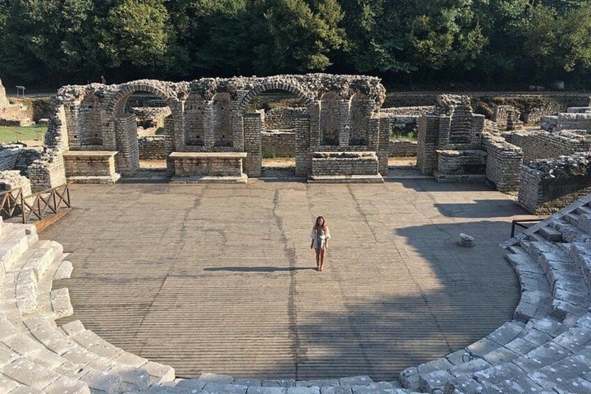 Ancient ruins with stone structures and a central open area. 3