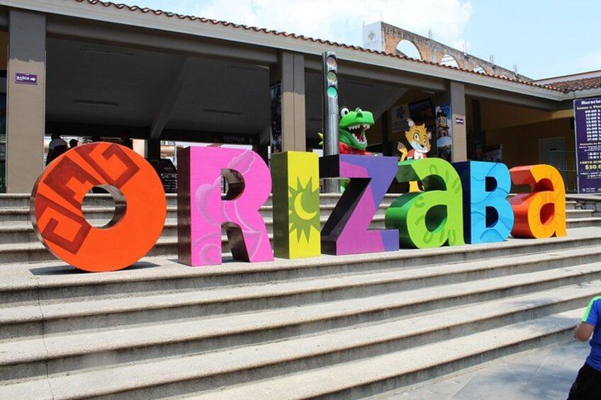 Colorful letters spelling 'ORIZABA' on steps. 3