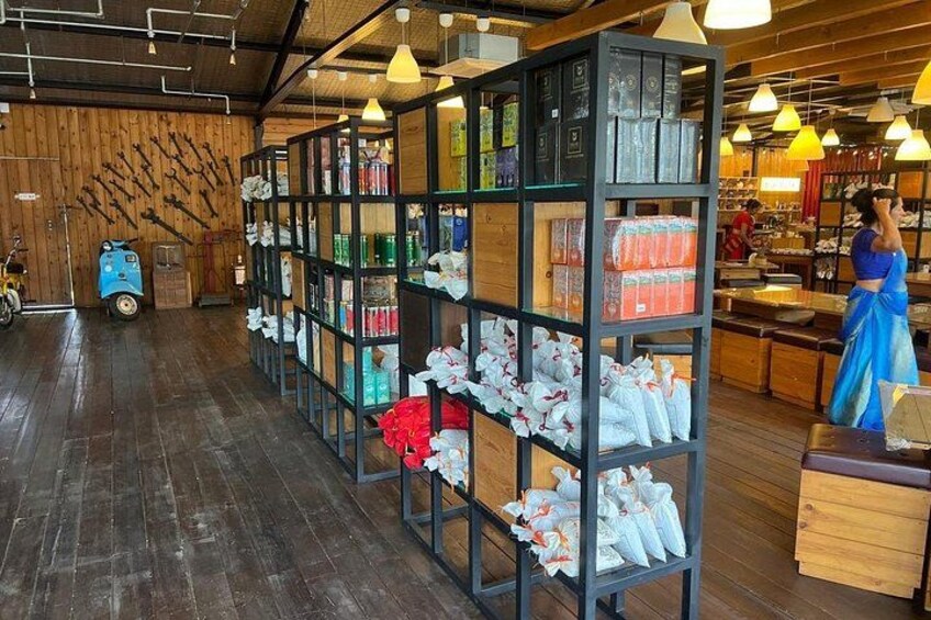 A store with wooden floors and shelves stocked with various items. 1