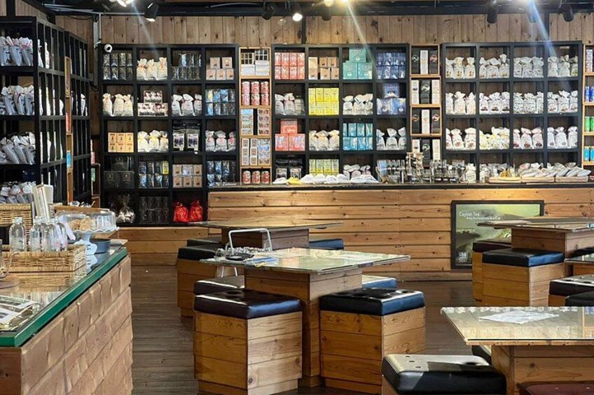 A store with wooden shelves stocked with various packaged goods. 4
