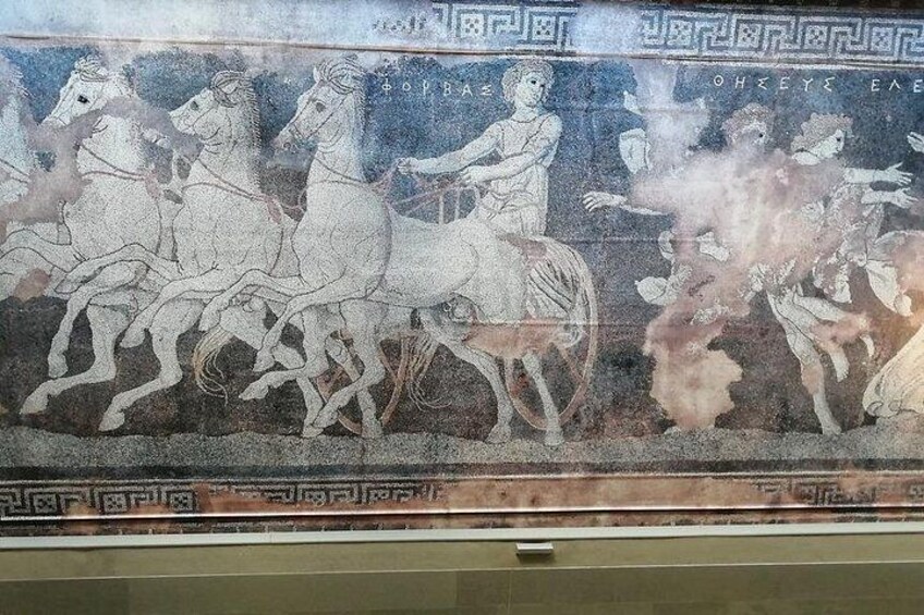 A mosaic with horses and riders, geometric patterns, and ancient Greek inscriptions. 4
