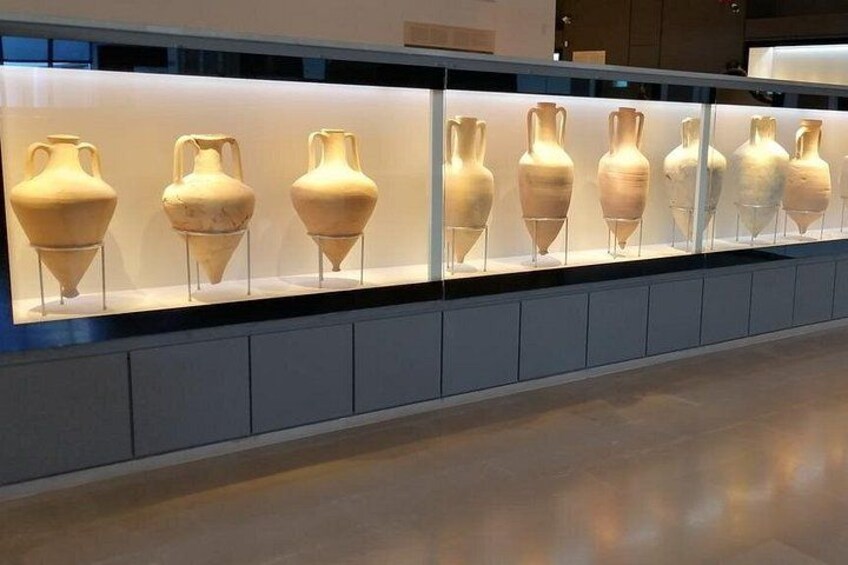 A museum display with ancient pottery. 5