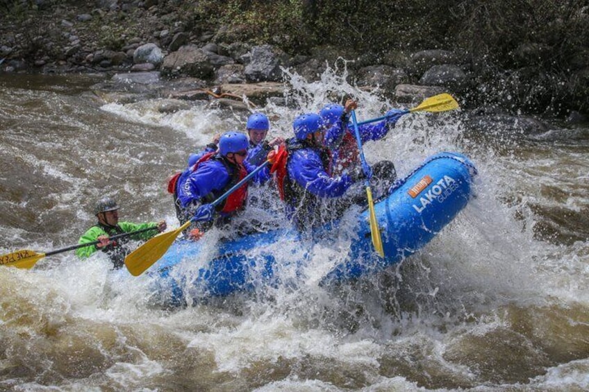 A group of people rafting on a river. 2