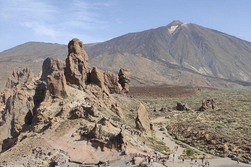 A rocky landscape with a prominent mountain in the background. 5