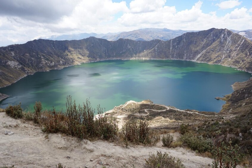 A large, circular lake surrounded by rugged mountains. 5