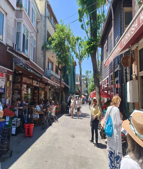 A bustling street market with vendors and shoppers. 5