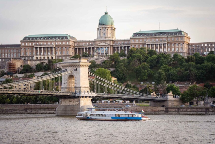 A river with a bridge and a boat. 2
