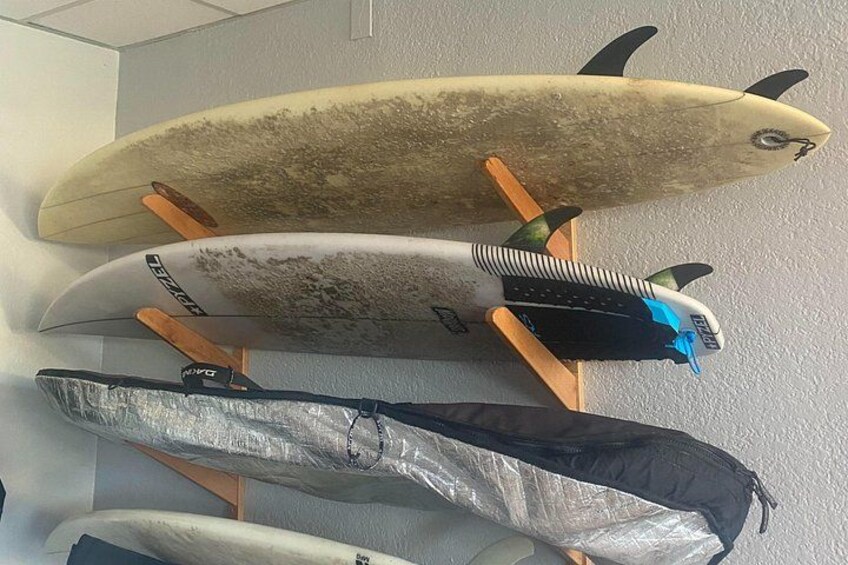 A surfboard rack with multiple surfboards. 4