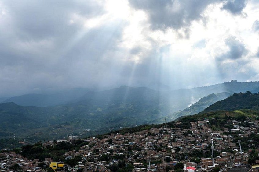 A mountainous landscape with a town nestled in the valley. 4