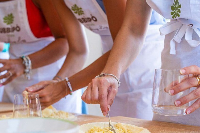 People serving food at a table. 3