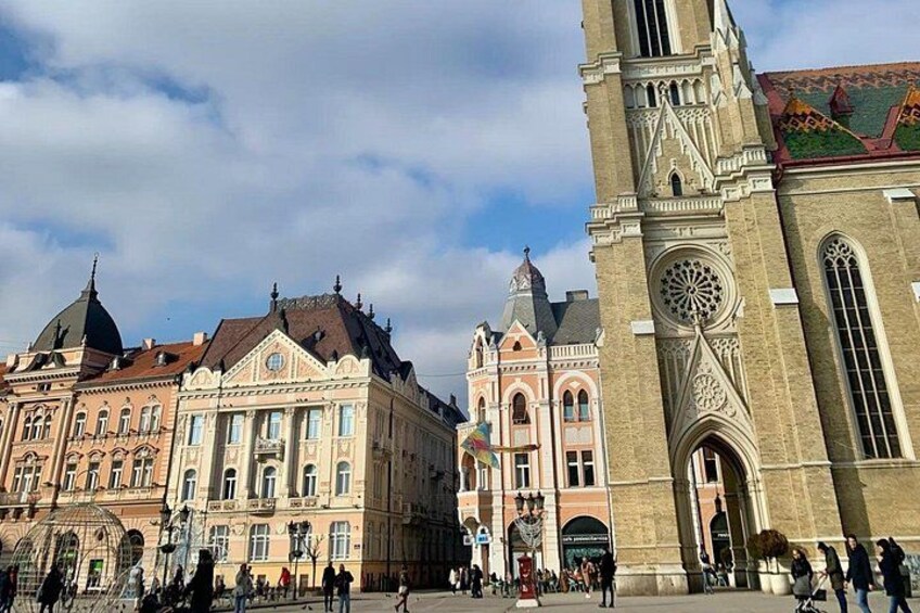 Historic buildings, a clock tower, and a public square. 3