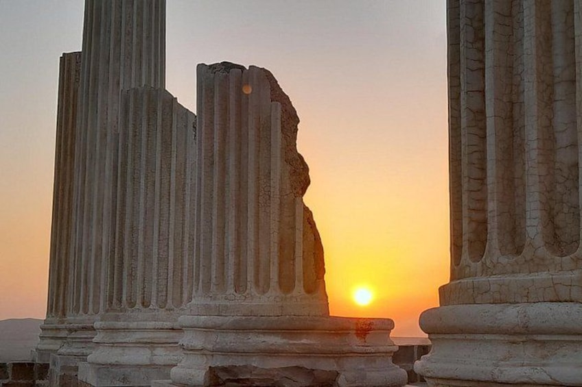 Ancient stone columns at sunset. 4
