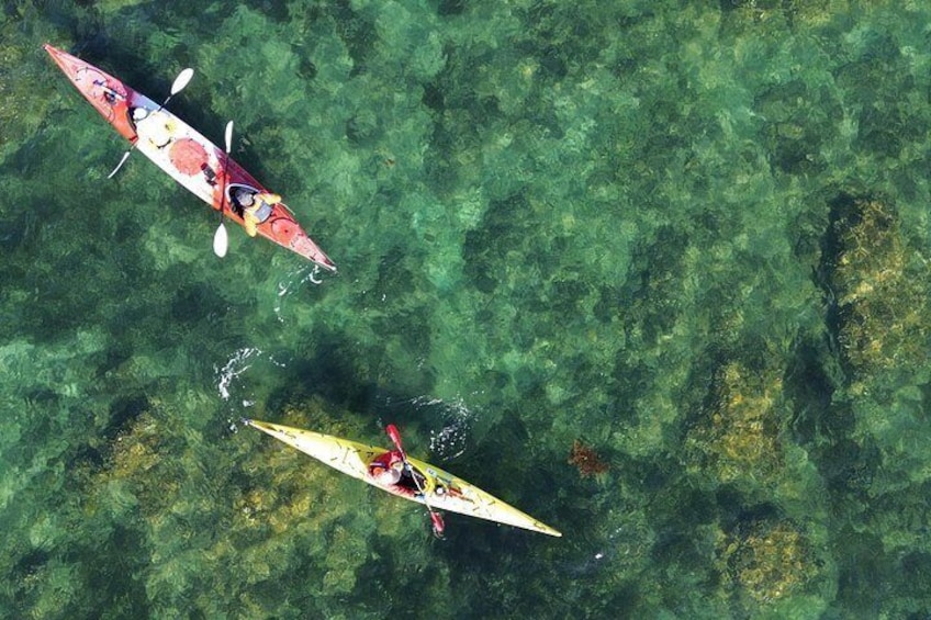Two kayaks on a clear body of water. 4
