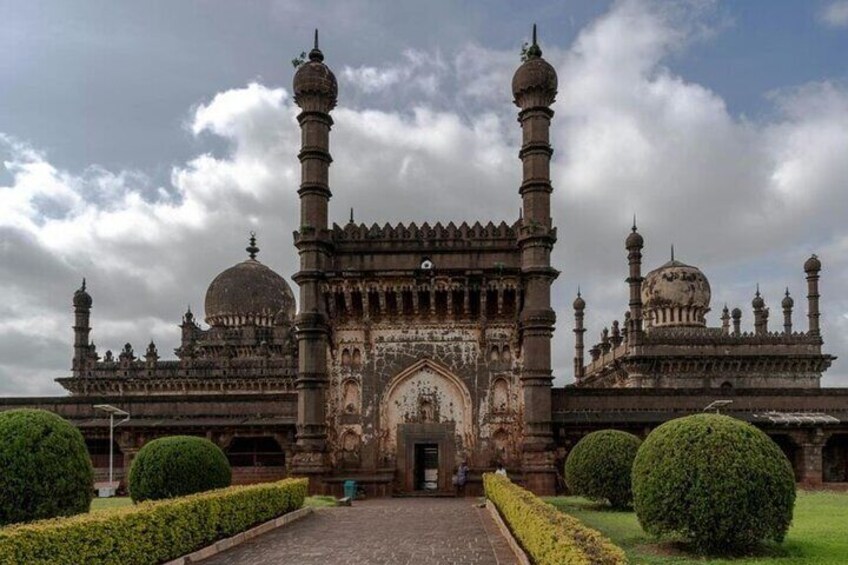 A historic building with intricate architecture, including domes and minarets. 1