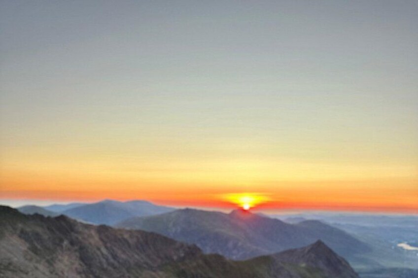 A sunset over a mountain range. 4