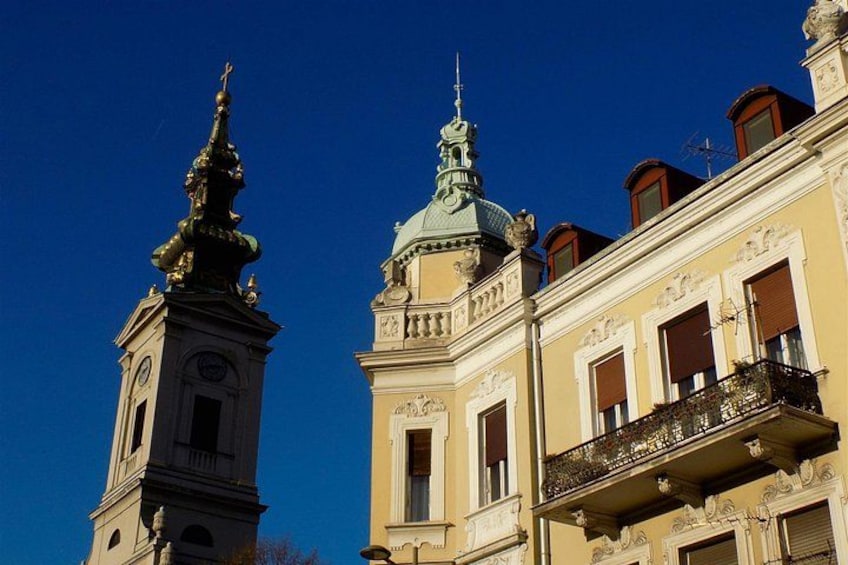 A building with a clock tower and a dome. 5