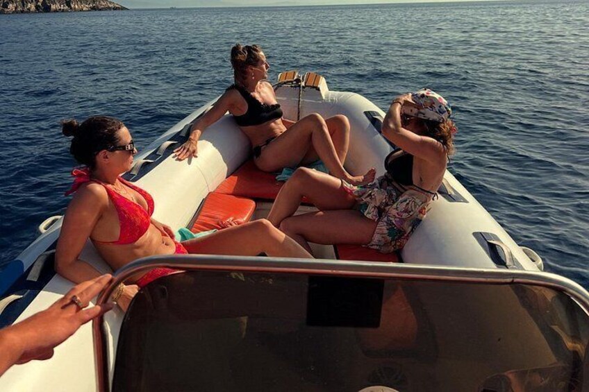 A group of people on a boat in the water. 4