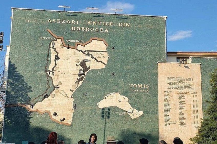 A large outdoor map with text and a list of names. 1