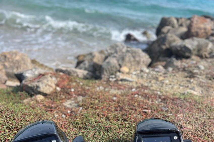 A rocky beach with waves in the background. 2
