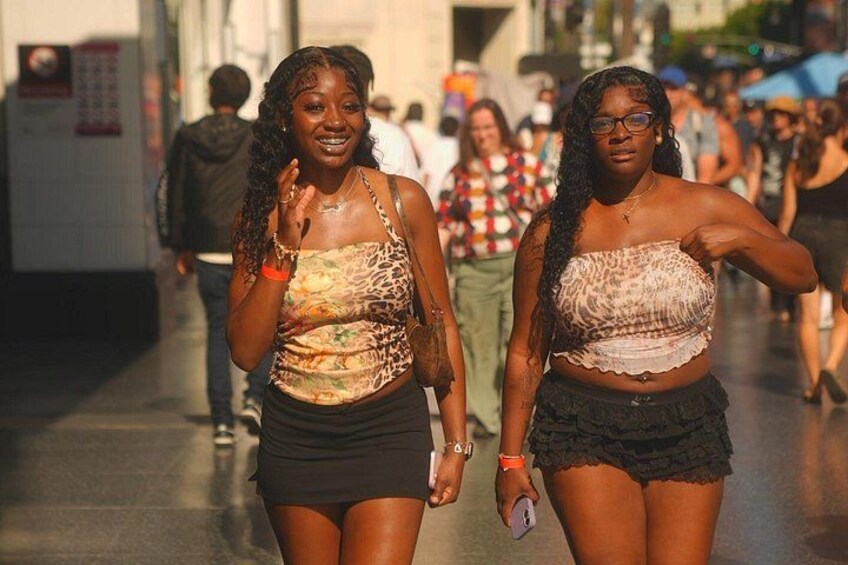 Friends strolling along Hollywood Boulevard, Los Angeles. 2