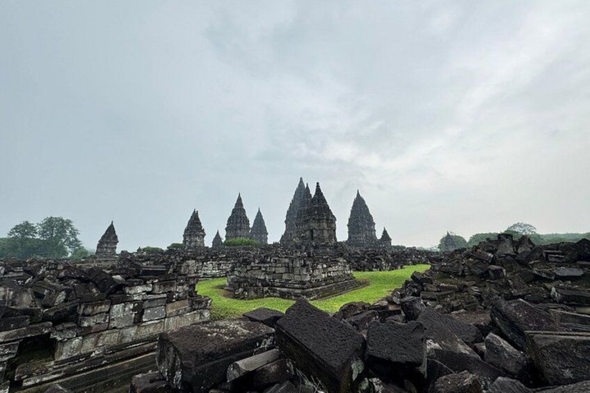 A ruined temple complex with multiple conical structures and a central courtyard. 3